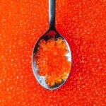 Close-up,Of,A,Spoon,With,Appetizing,Red,Caviar,Against,The