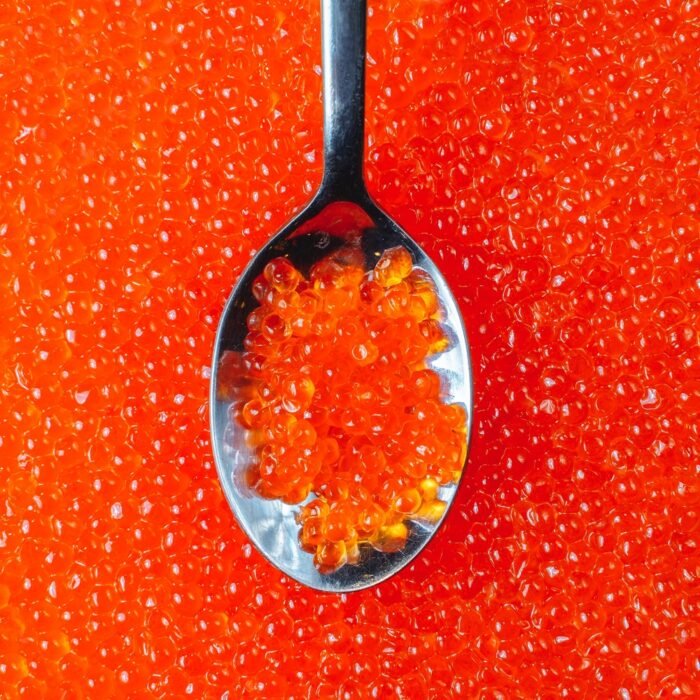 Close-up,Of,A,Spoon,With,Appetizing,Red,Caviar,Against,The
